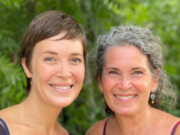 Sari González and Becka Koritz smiling at the camera.