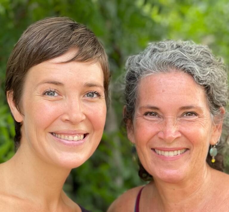 Sari González and Becka Koritz smiling at the camera.