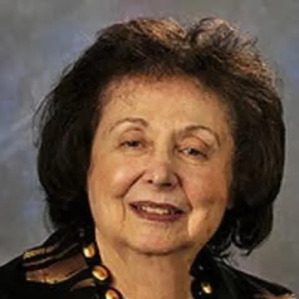 Photo of Fredericka Reisman smiling at the camera.