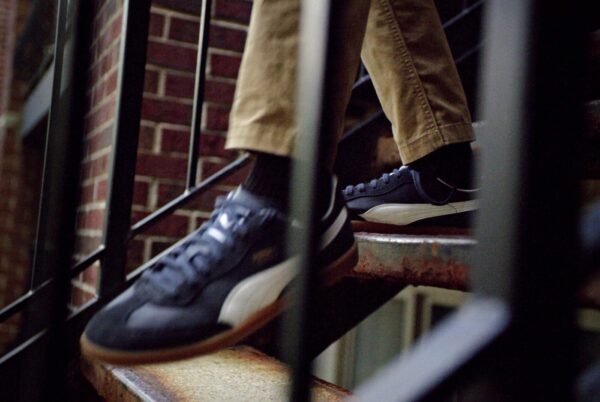 Closeup photo of Puma shoes going down stairs