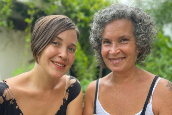 Sari González and Becka Koritz smiling at the camera.