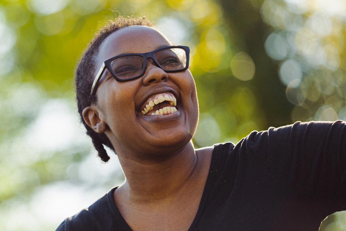 Closeup of Crystal Farmer looking up and smiling to someone off camera.